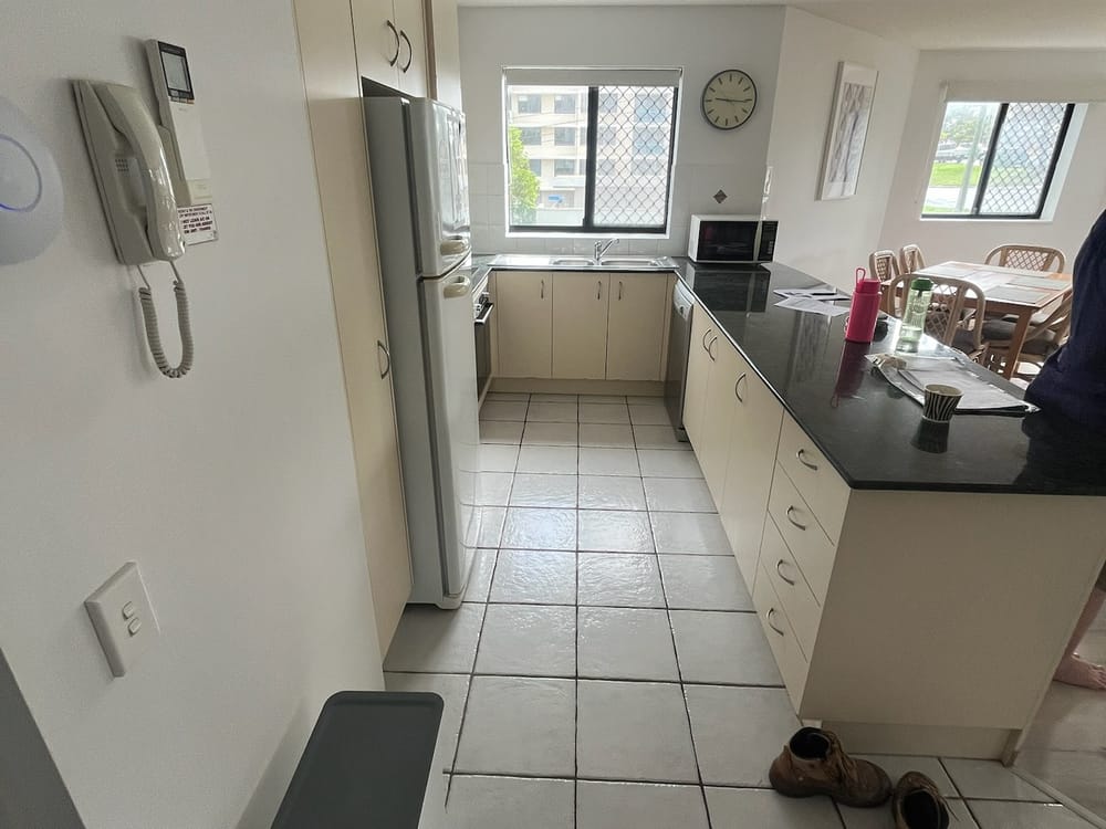 Kings Beach kitchen before renovation — dated cream cabinets