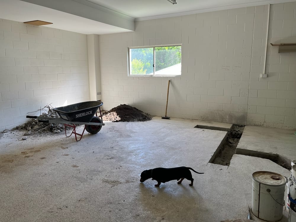 Maleny garage before conversion — bare block walls and concrete floor